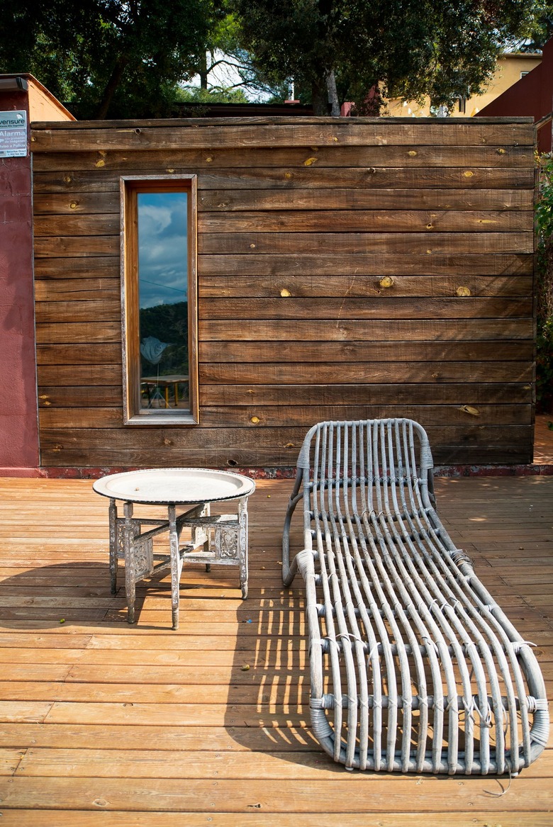 Deck with vintage lounge chair and table