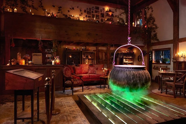 Interior of the Hocus Pocus Cottage with an ancient red couch