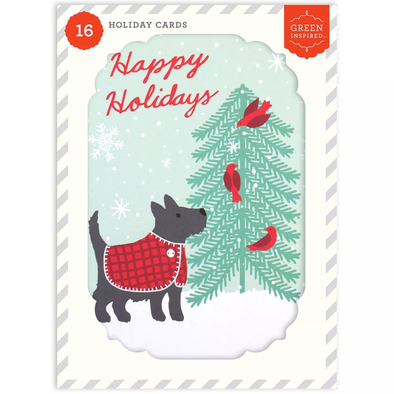 dog with red sweater near xmas tree