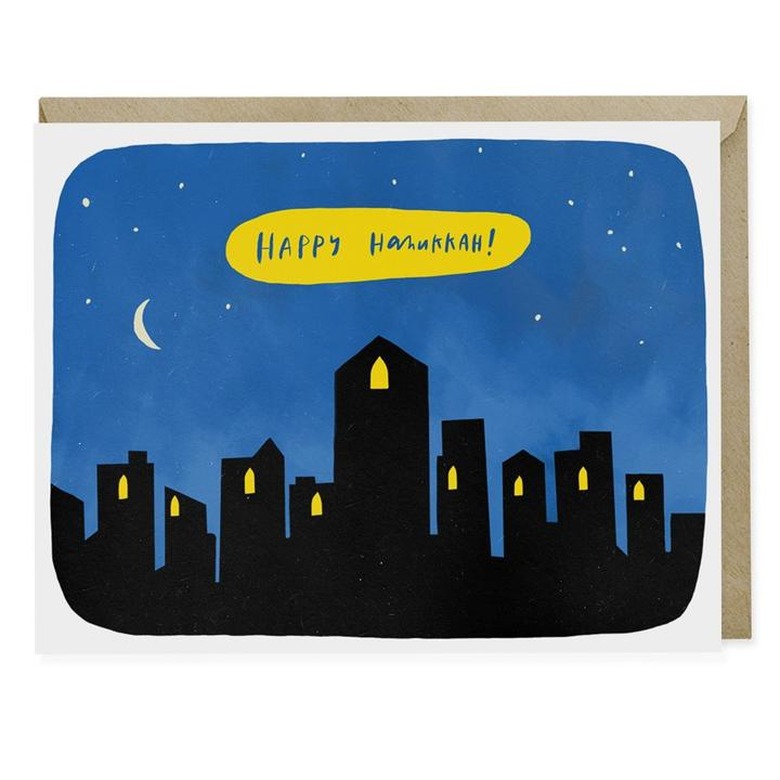 hannukah greeting card with silhouettes of buildings