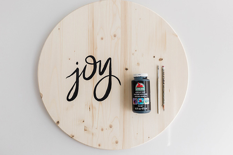 Paint the word joy on the face of your wooden circle.