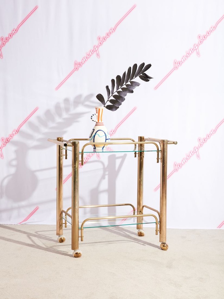 brass bar cart with vase and flower Hollywood Regency accessory from Coming Soon New York