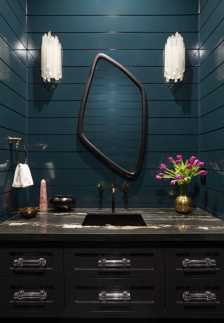Hollywood regency powder bathroom with glossy teal walls