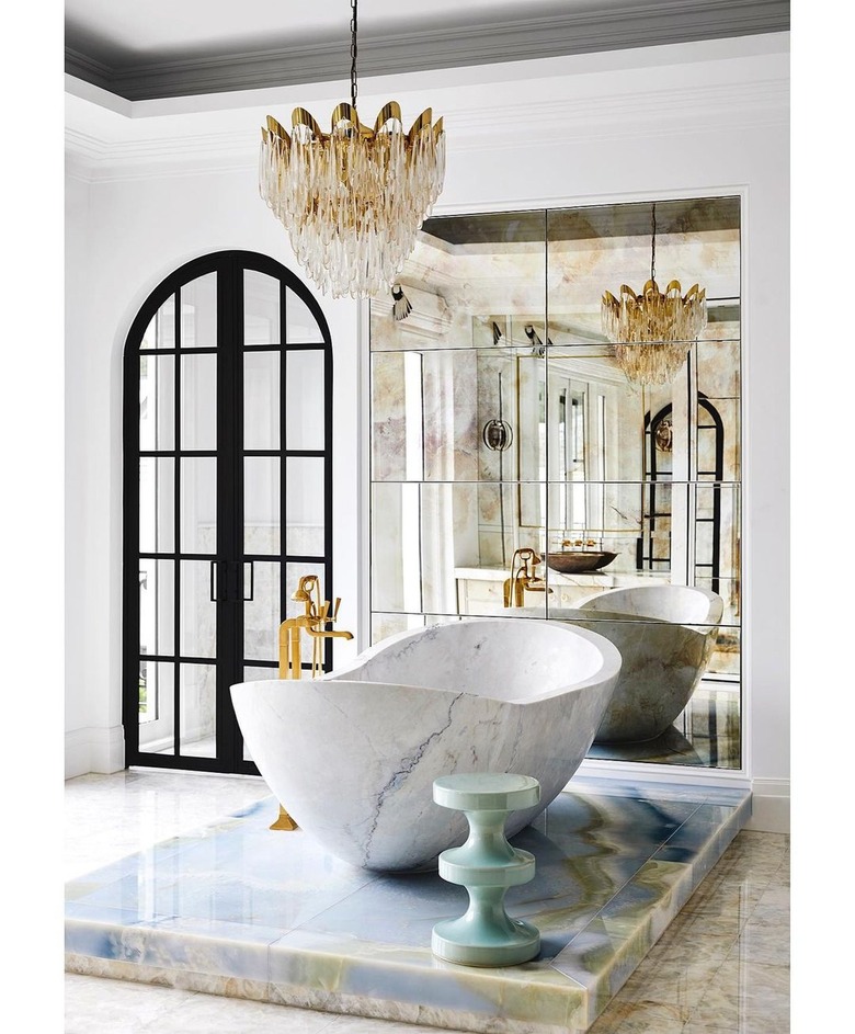 Hollywood regency contemporary bathroom with crystal and brass chandelier