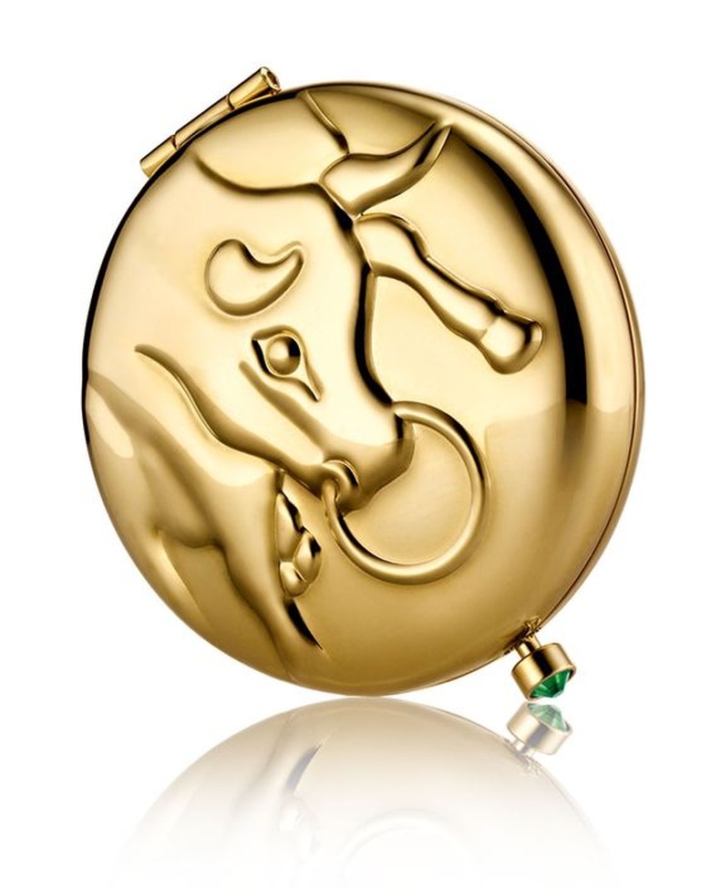 Gold compact with Taurus bull