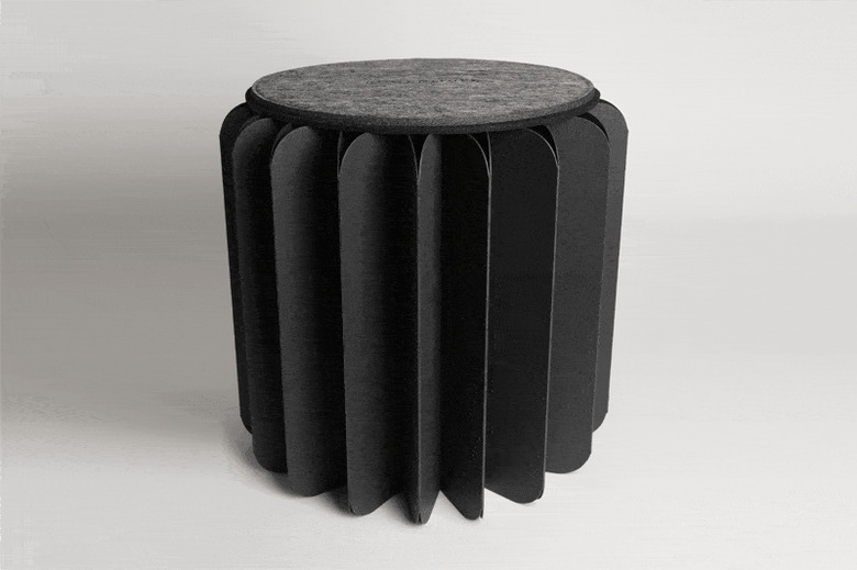 Animation of how circular folded paper table closes into book form