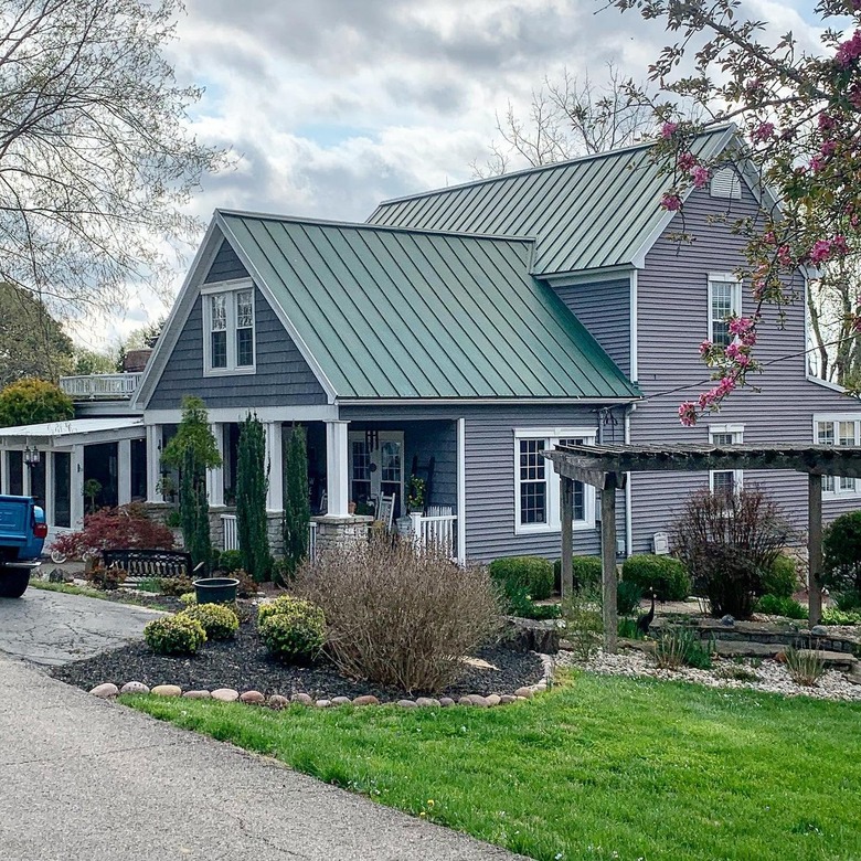 gray house with green roof