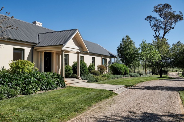 taupe house with green roof