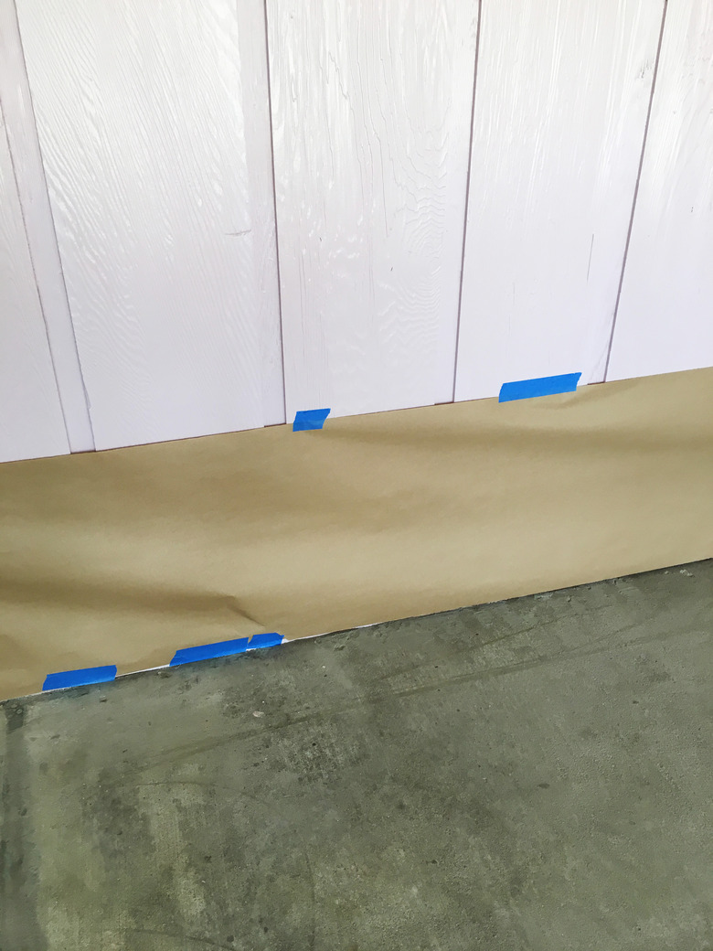 Blue masking tape along walls.