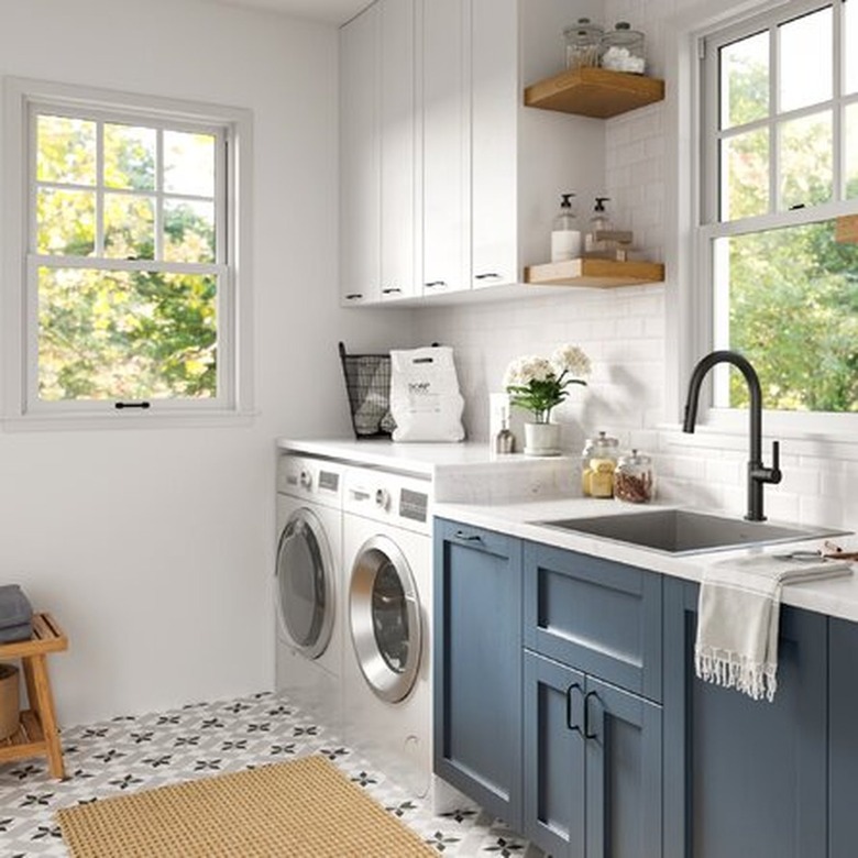 A laundry room with a side-by-side washer and dryer