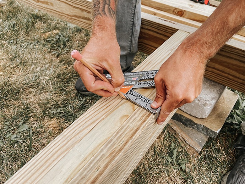 Mark spots for joist hangers.