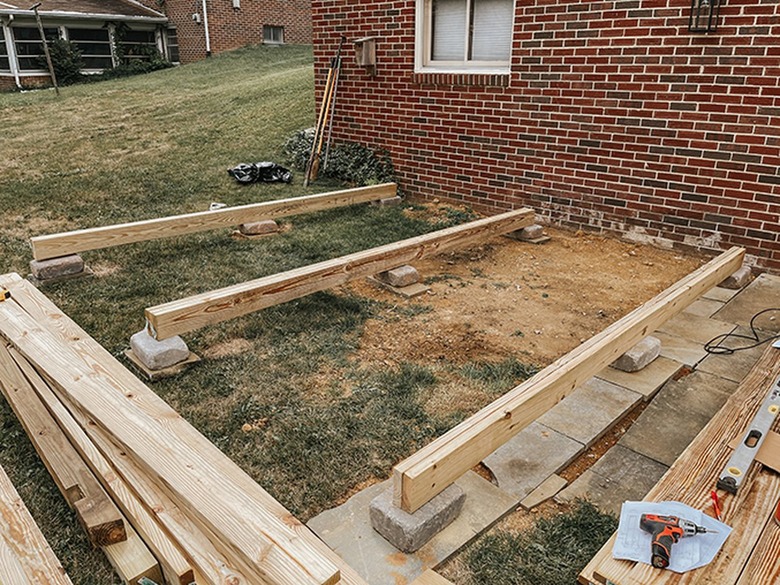 Place the beams on top of the blocks.