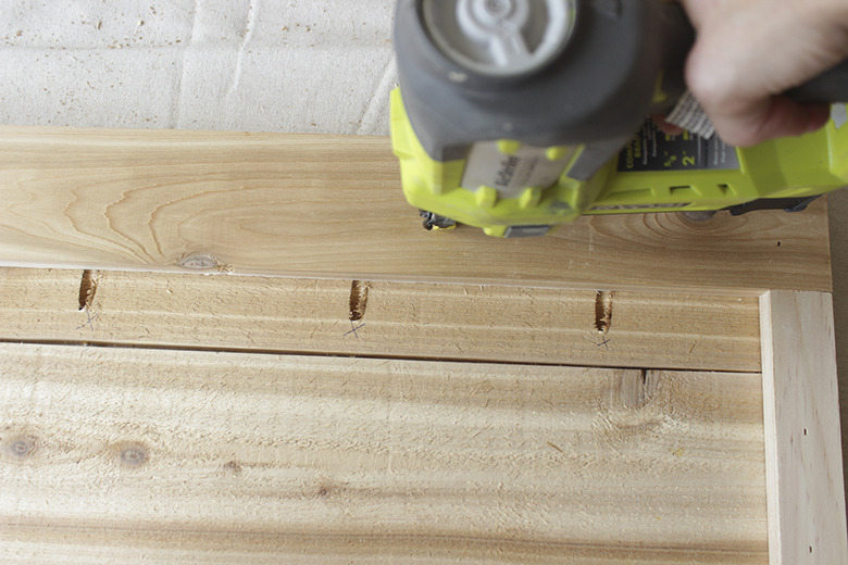 Nailing support frame to planked bar.