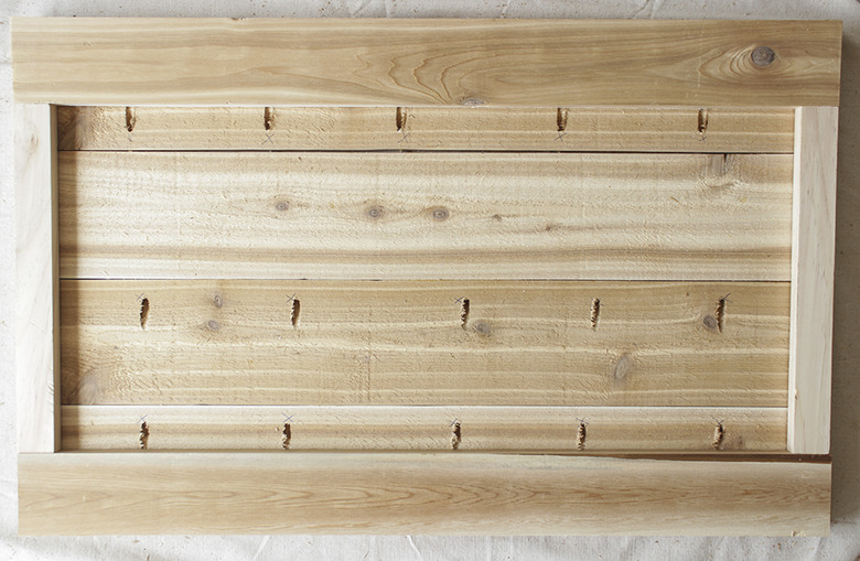 Support frame ready to be nailed to planked bar.