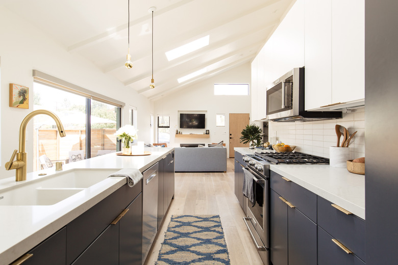 kitchen with navy blue and white cabinetry