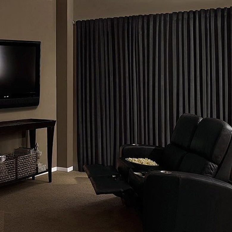 Blackout curtains in a home theater room