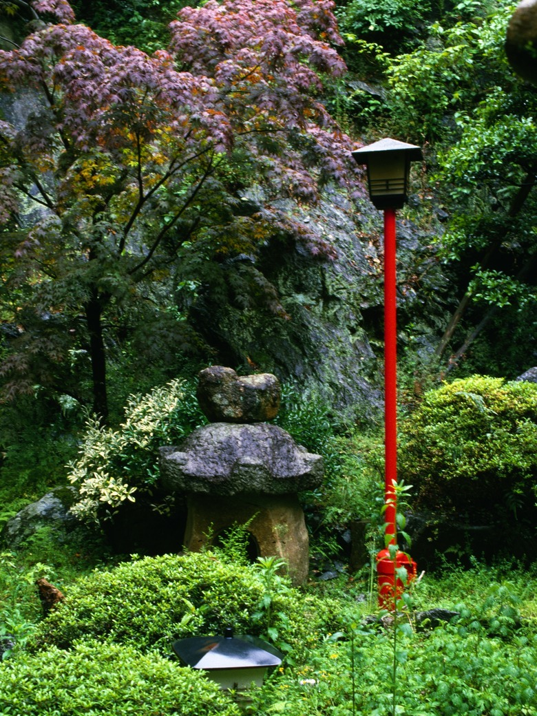 Lush landscape with lamp post