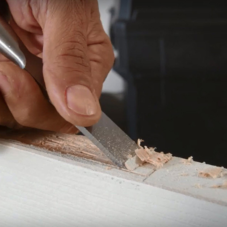 Chisel door hinge mortise.