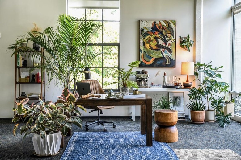 eclectic white office with large abstract artwork