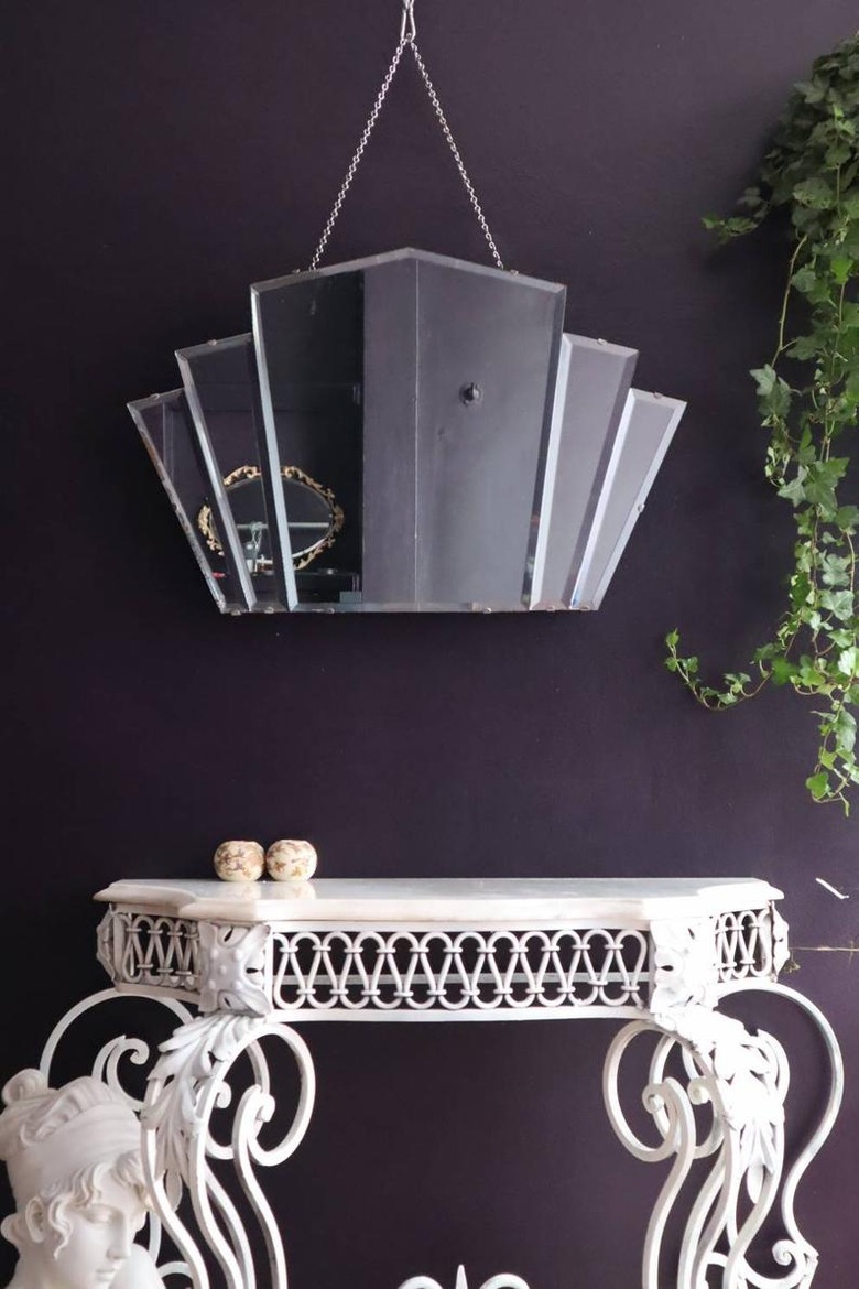 art deco mirror near white table