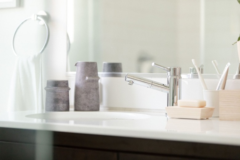 bathroom sink with chrome faucet and modern ceramics