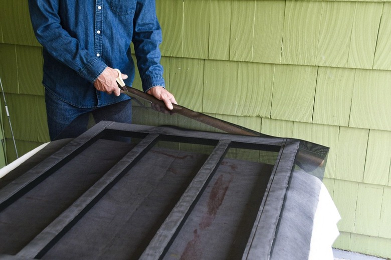 cutting screen door mesh with scissors