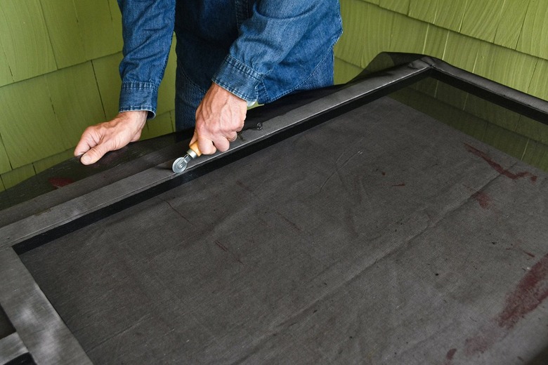 rolling screen door mesh with a spline roller tool