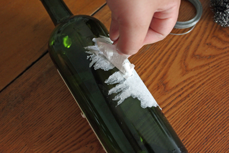 Peel off the label by hand.