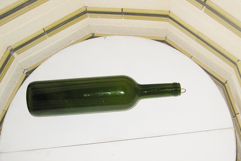 Melt the bottle in the kiln at 1