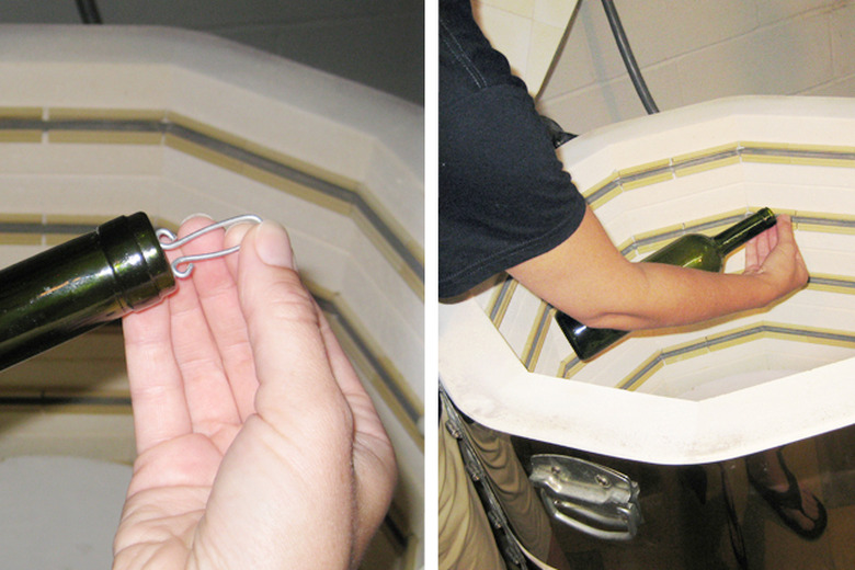 Add a wire for hanging and place the wine bottle in the kiln.