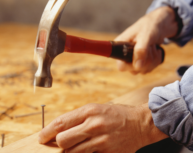 Man hammering nail