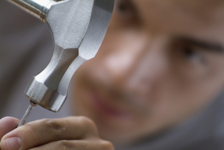 Man hammering nail