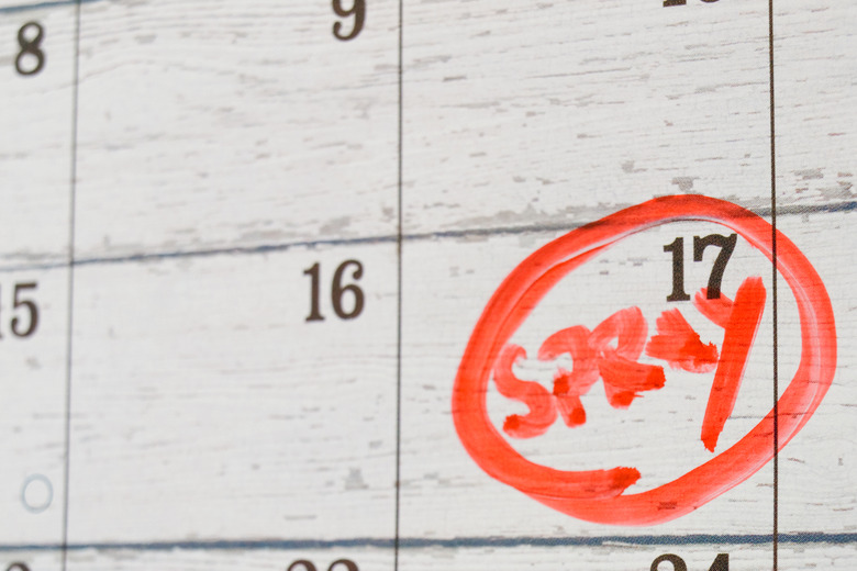 A calendar with spray circled in red