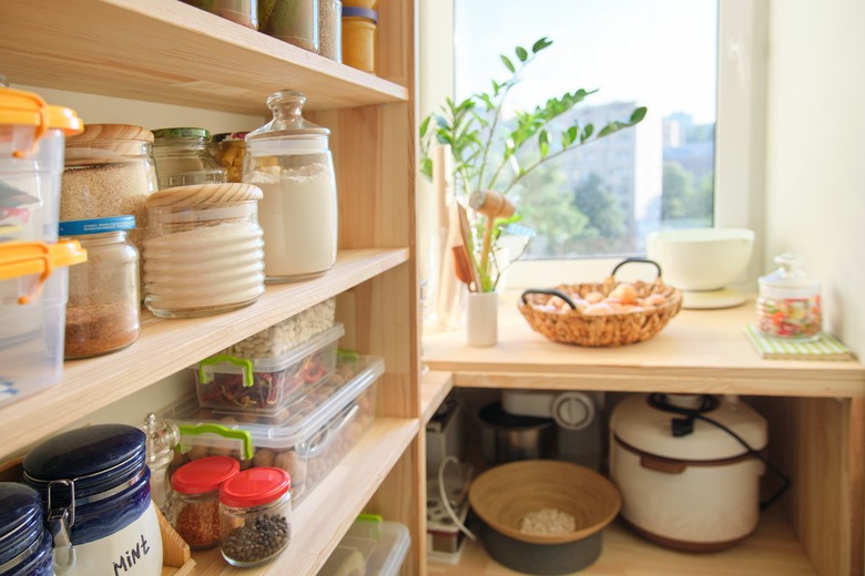 Wooden shelves with food and utensils