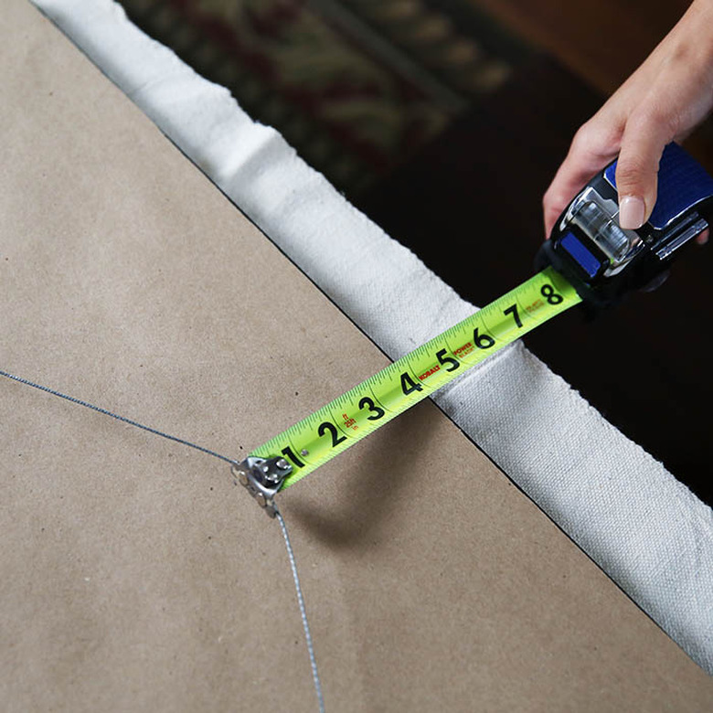 Hanging wire on back of mirror.