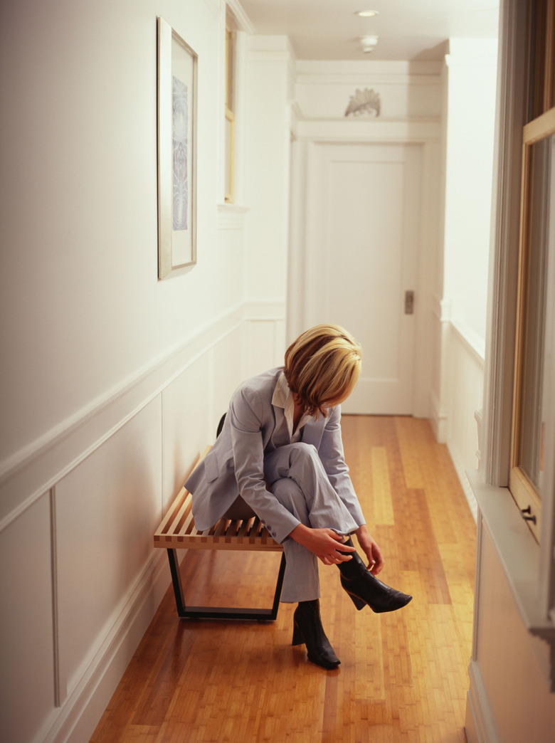 Woman taking off shoes