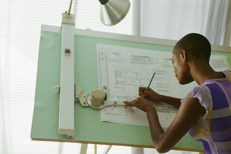 Architect Sketching at Drafting Table