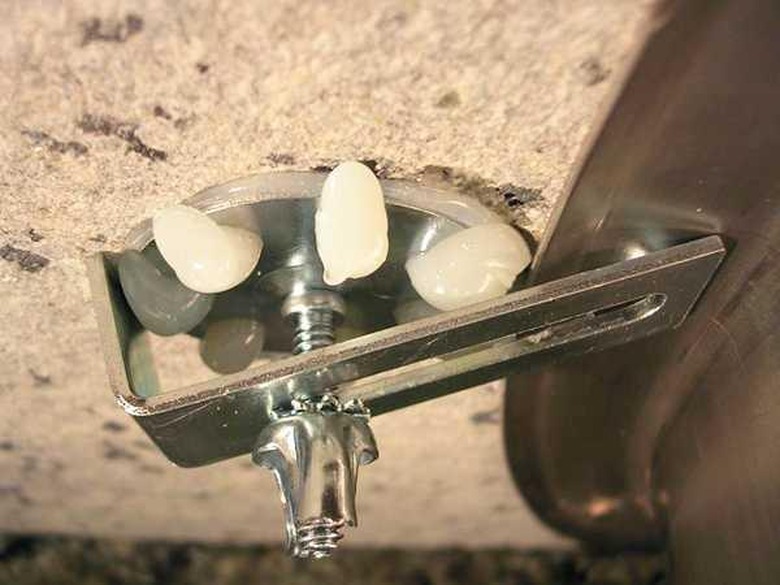 Support posts for under-mount sink.