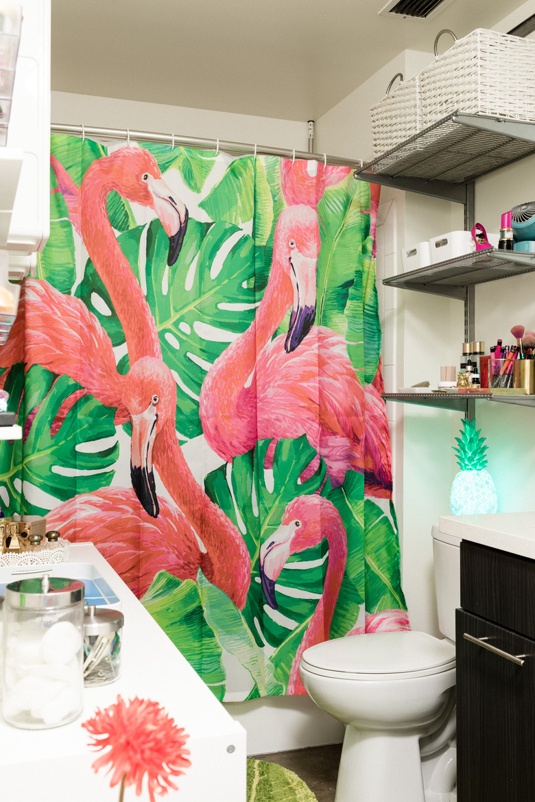 small bathroom with flamingo shower curtain