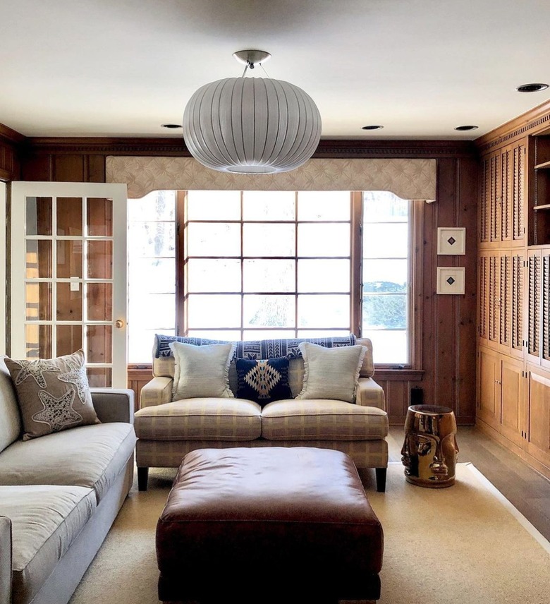 knotty pine sitting room with traditional furniture
