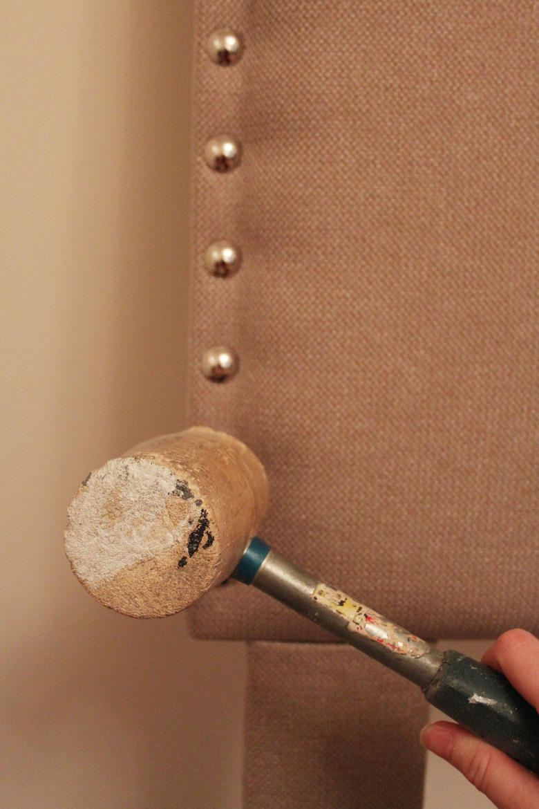Use a rubber mallet to gently tap nailhead in place.