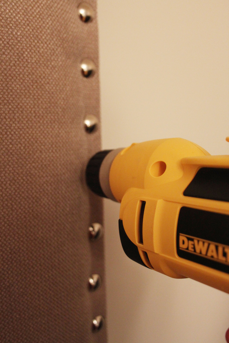 Drill holes for the nailhead trim.