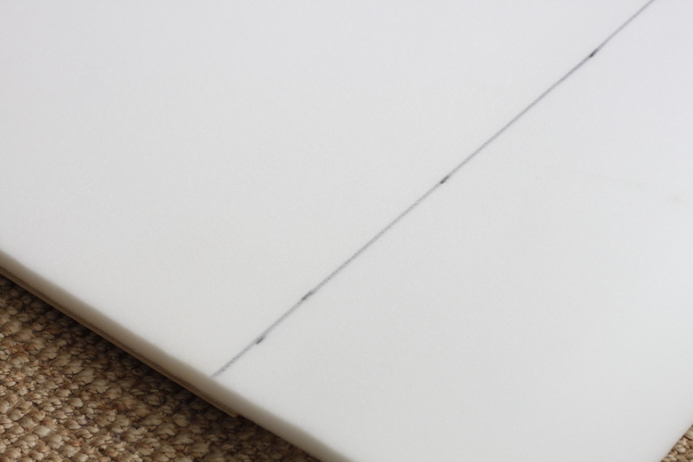 Use a pencil to mark the foam before cutting.