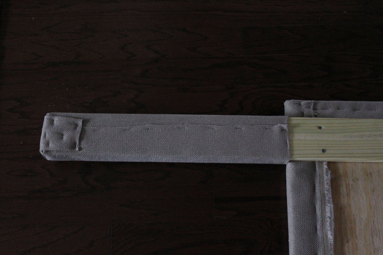 Bottom portion of the board wrapped in fabric.