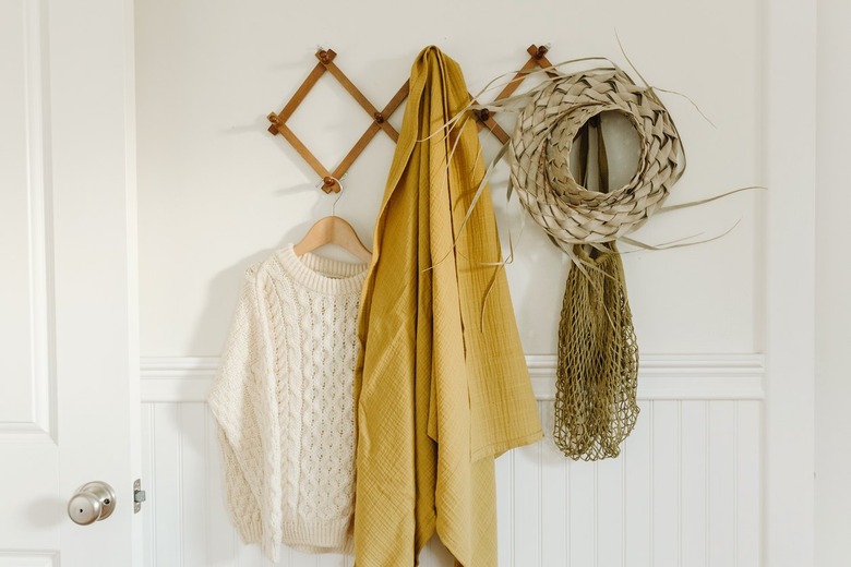 Coat rack with white sweater