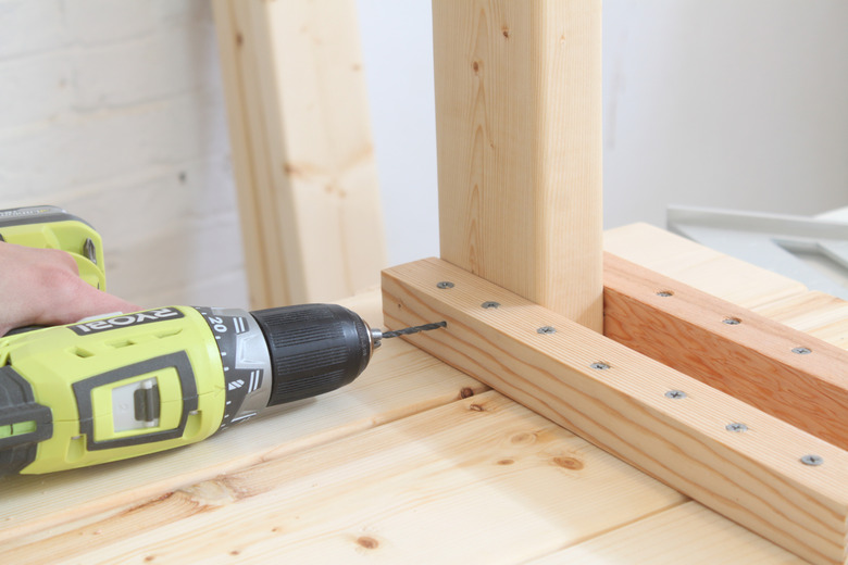 Drilling a pilot hole into the leg