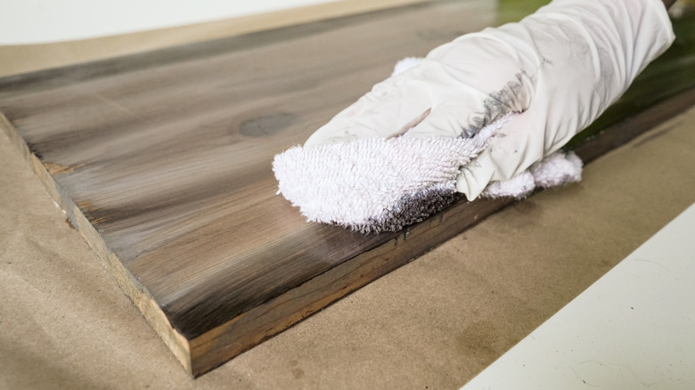 Blending gray and brown wood stain for weathered wood finish.