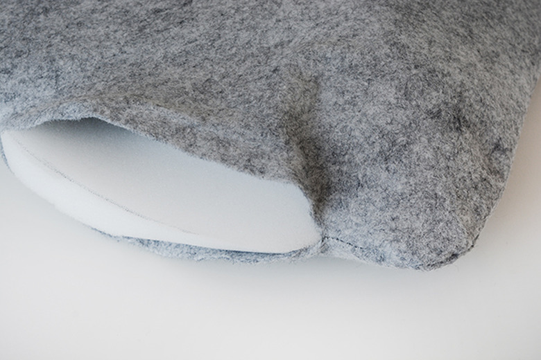 Stuff the foam into the seat cushion cover.