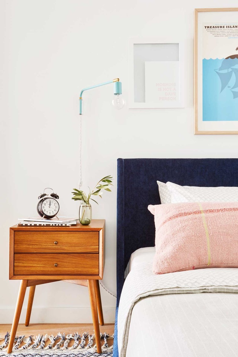 white bedroom with colorful accents