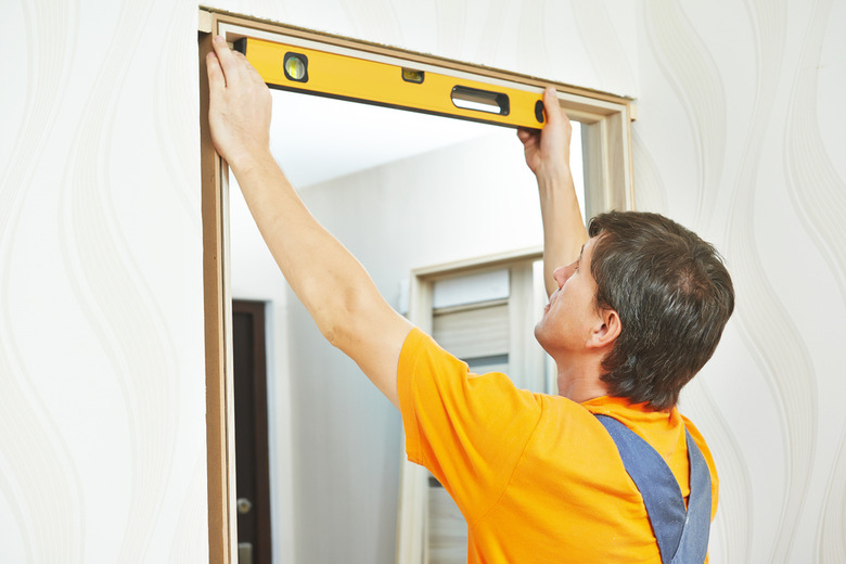 Man installing prehung door.